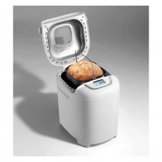 Hljeb ispod podignutog poklopca pekača hljeba Gorenje