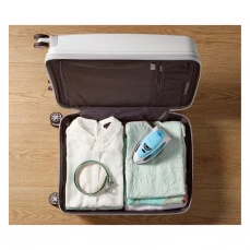 Putna pegla na paru Gorenje, plava unutar kofera